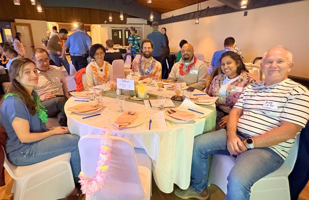 A group of medical professionals sitting around a table at a qathet Division of Family Practice Member event.